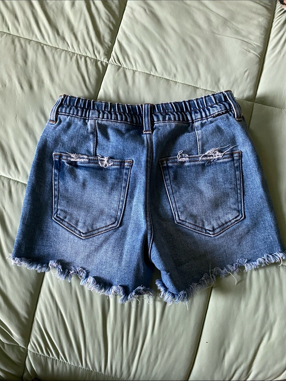 Risen Jeans. Distressed High-Rise Denim Cutoff Shorts in Blue - Picture 3 of 3